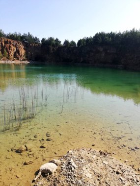 An atmospheric sunset over a beautiful lake in the park. 