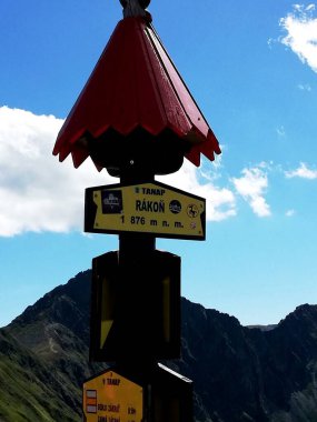 Signpost on the mountain trail. Polish mountains. The direction of travel.
