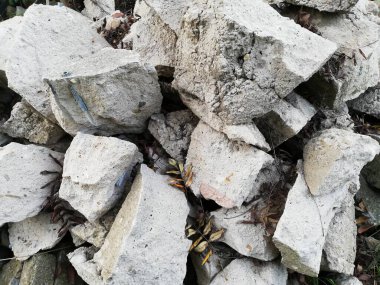 Stones and rocks. An old crumbling wall with a beautiful, rough structure. 