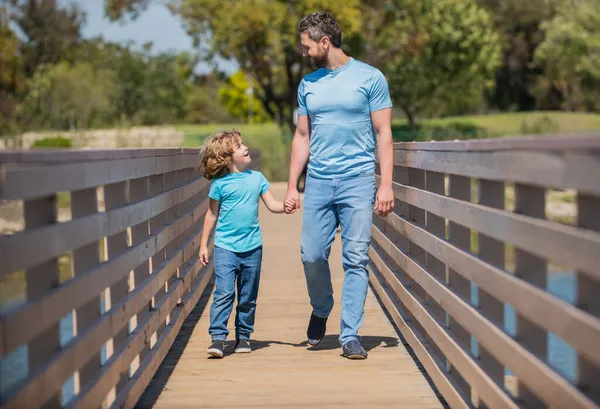 Happy single dad leading small son outside, adoption — Stock Photo, Image