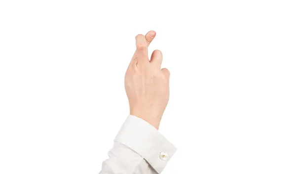 Dedos cruzados gesto de fazer um desejo com a mão masculina isolado em branco, falsas promessas — Fotografia de Stock