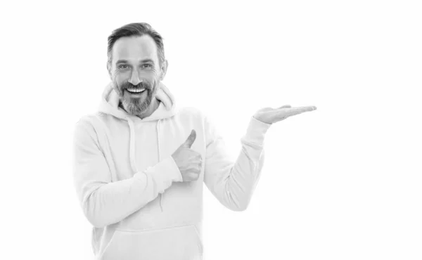 Advisor man in yellow hoody. adult guy advertising. male casual sporty fashion. copy space. thumb up — Stock Photo, Image
