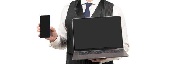 Uomo ritagliato che presenta laptop e smartphone isolati su sfondo bianco, presentazione — Foto Stock