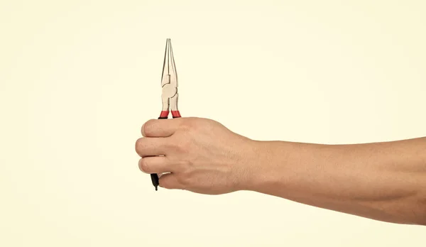 Male hand holding pliers. building and repairing tools. hand with repair tool — Φωτογραφία Αρχείου