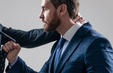 Professional man broker pull necktie during physical fighting grey background, fight
