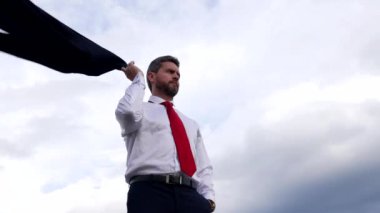 serious confident man boss on sky background, agile business