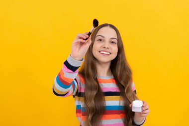 Happiness is the best makeup. Happy child smile holding makeup brush. Beauty artist. Be beautiful