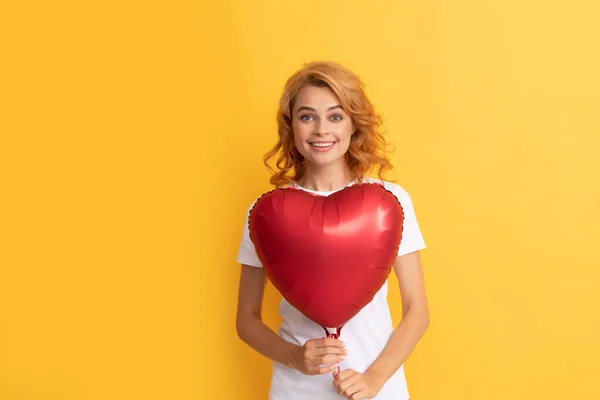 Happy redhead girl with love heart balloon. charity and donation — Φωτογραφία Αρχείου