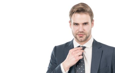 Portrait of serious professional man adjusting necktie in formal business suit, guy