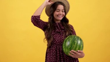 happy teen girl wear straw hat on water melon, summer