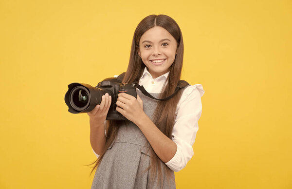 cheerful child girl take photo with digicam, photography