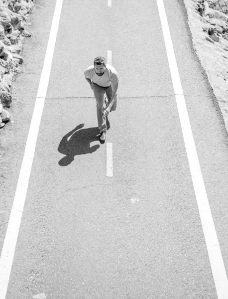 Mature athletic guy running on road outdoor, energetic — Stock Photo, Image