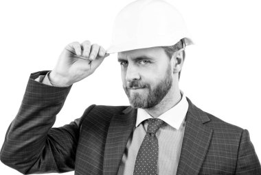 Güvenlik işi. Karşılama jesti ile başarılı bir adam. Koruyucu miğferli girişimci.