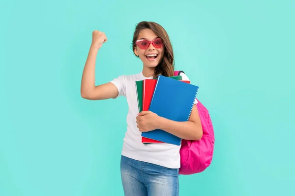 Happy teen girl with backpack and copybook in sunglasses ready to study at school, knowledge — Stock Photo, Image