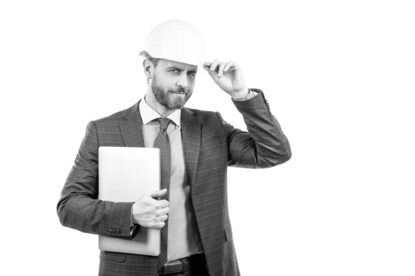 Confident businessman man in suit and safety helmet hold laptop isolated on white copy space, boss — Stock Photo, Image