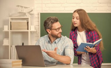 curious teen girl and teacher man in high school with workbook and pc at blackboard, parenthood clipart