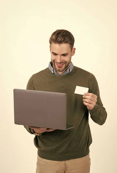 man pay in online banking. online shopping. cyber monday. fast pc payment. handsome man with laptop.