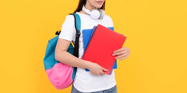 Student hold notebook. girl holding notebook on yellow background. private teacher — Foto de Stock