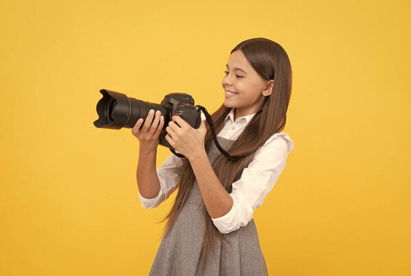 having skills. snapshot. childhood. teen girl taking photo. kid use digital camera.