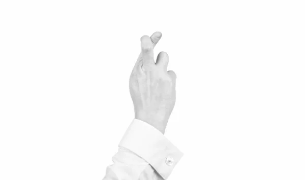 Dedos cruzados gesto de fazer um desejo com a mão masculina isolado em branco, falsas promessas — Fotografia de Stock