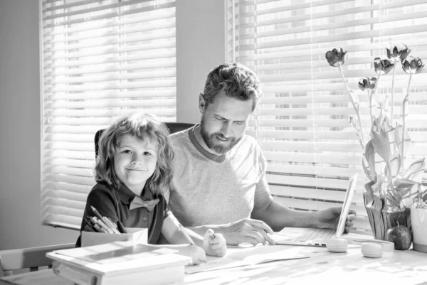 Education concept. homeschooling and help. back to school. parenthood. cheerful father and son — Stock Photo, Image