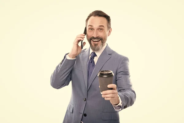 Businessman speak on smartphone and drink tea. amazed man boss has coffee break conversation. — Stock Photo, Image
