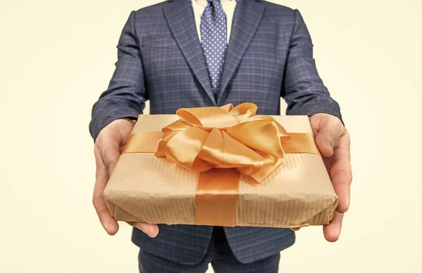 Cropped businessman man sharing present box isolated on white, selective focus, corporate present. — стоковое фото