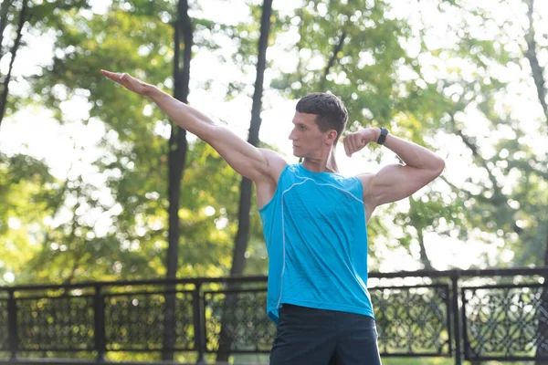 Athletic man standing in bodybuilder pose. sport training — 스톡 사진
