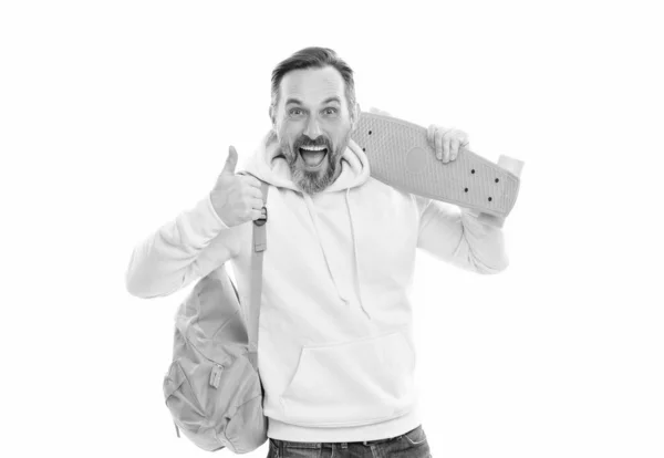 Smiling senior guy back to school isolated on white. man in yellow hoody with skateboard. — Foto de Stock