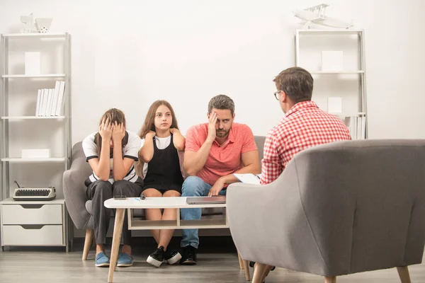 phone addicted father mother and child at family psychologist, consultant