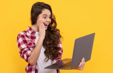 surprised smart kid hold laptop during school online lesson, video call