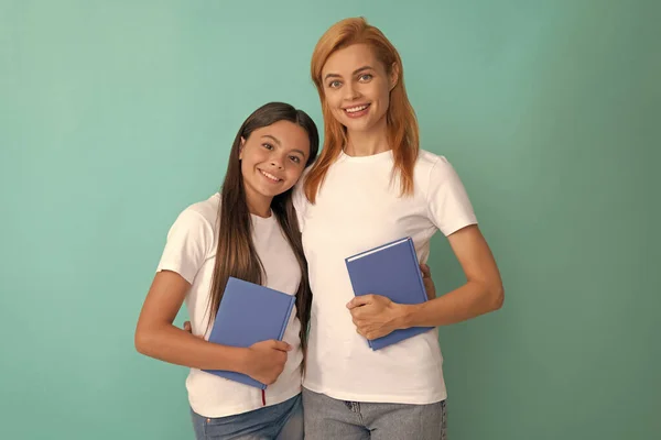 Friendly private teacher and child holding book, knowledge — Stock Photo, Image