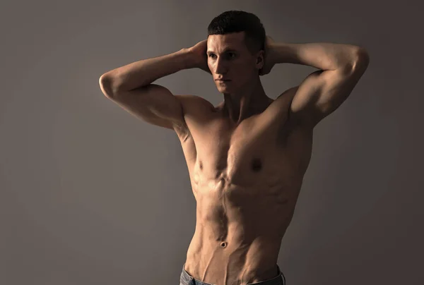 Shirtless and bare-chested. Shirtless man grey background. Fit guy with muscular torso — Stock fotografie