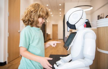 little boy interact with robot artificial intelligence, communication