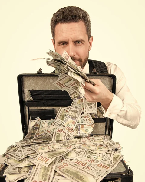 Rich millionaire holding case full of dollar cash isolated on white background, bribe — Stock Photo, Image