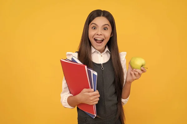 Everyday school surprises me. Surprised child hold apple and books. Back to school. Knowledge day — Stockfoto