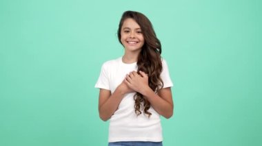 cheerful cute child long curly hair show heart gesture, love