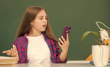 amazed kid with vintage telephone. conversation. teen girl wear retro clothes. childhood.