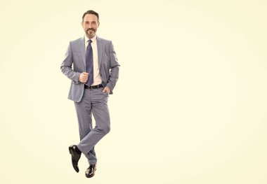 happy grizzled businessman in suit full length isolated on white copy space, business fashion.