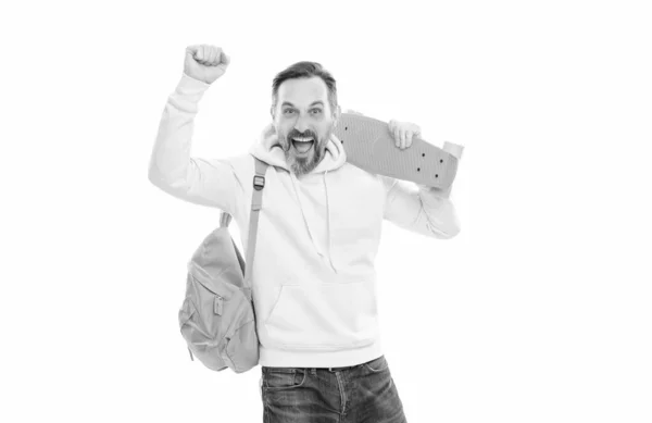 Happy handsome mature man hipster with backpack and penny board isolated on white, skateboarder. — стоковое фото