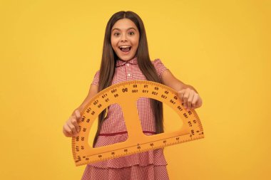 education for child. mathematics. amazed teen girl hold protractor ruler. back to school.