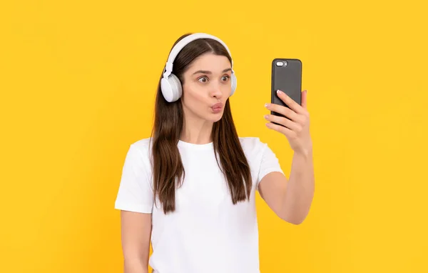 Young Girl Listen Music Headphones Hold Phone Yellow Background Selfie — Stock Photo, Image