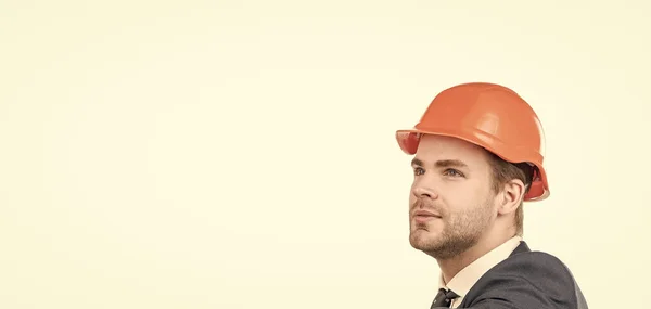 We are made for engineering. Serious engineer portrait. Civil engineer in hardhat. Construction man face. Building expert isolated on white, copy space.