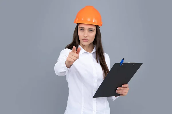 Serious Woman Protective Helmet Clipboard Isolated Grey Background Young Woman — Stock Photo, Image