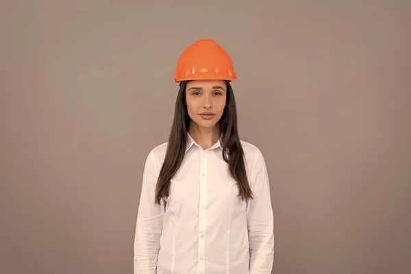 woman worker in white shirt. quality inspector. female construction worker. businesswoman in builder hardhat. chief architect engineer. entrepreneur in protective helmet. safety business. labor day.