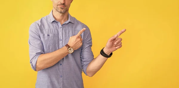 cropped man pointing finger on copy space. guy with hand watch. man showing wristwatch. you are late. deadline. time management. mens wardrobe. modern life success. male fashion accessory.
