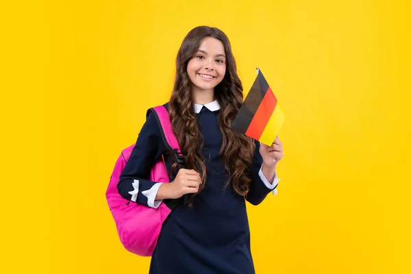 Education and learning in Germany, schooling in Europe. Deutschland, deutsche flag. Schoolgirl hold germany flag, study in Germany. Teen girl student