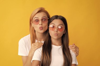 happy family portrait of woman mother and kid in glasses blow kiss, togetherness.