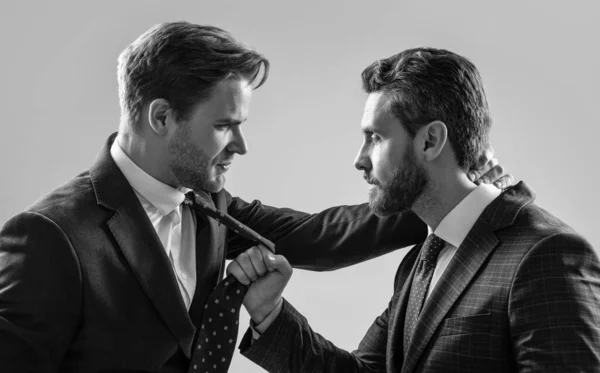 business partners blame each other. arguing businesspeople. dissatisfied men discuss failure. two colleagues have disagreement and conflict. businessmen face to face. disrespect and contradiction.