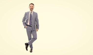 happy grizzled business man in suit full length holding laptop isolated on white copy space, business professional.
